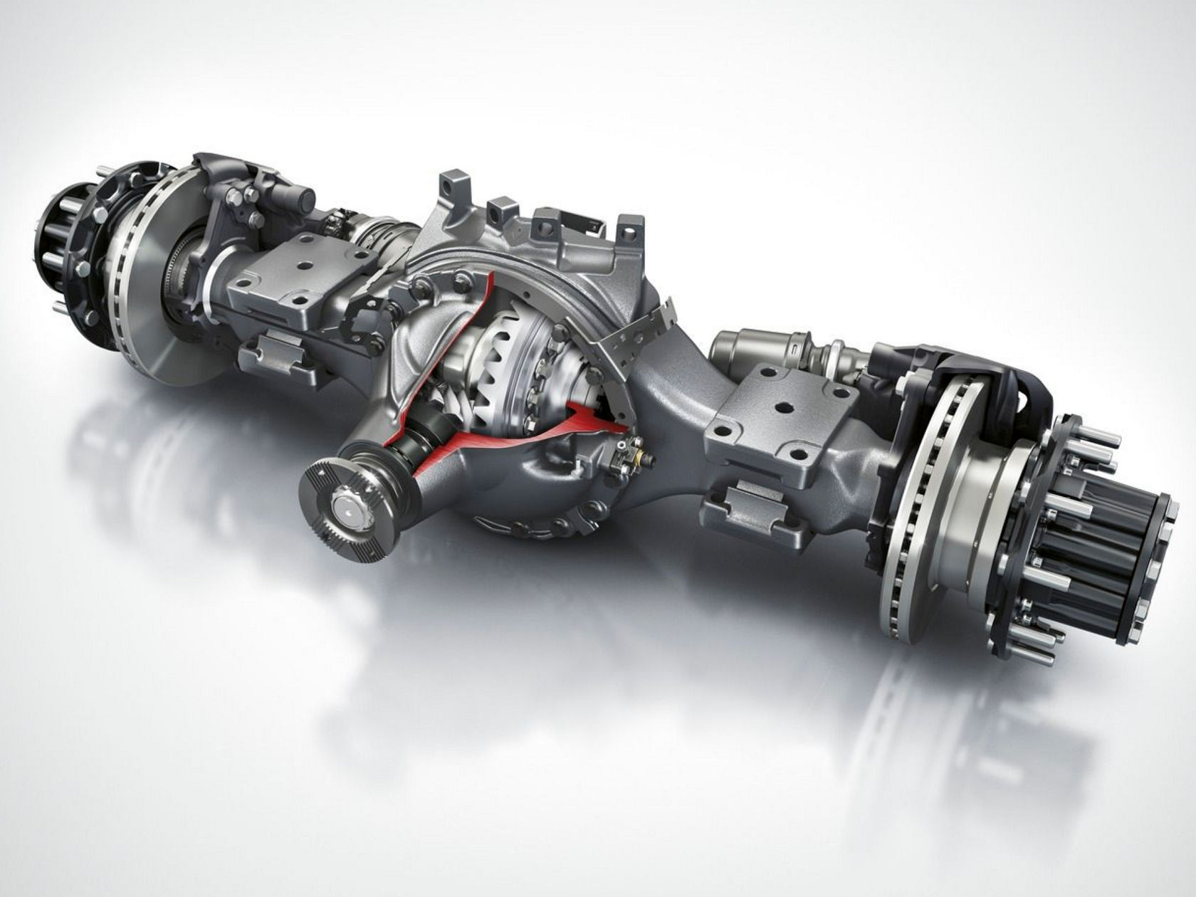 The image shows a detailed technical representation of a rear axle with transmission parts partially cut open to show the internal mechanisms. The components are in shades of grey, with red accents that highlight the cut surfaces.