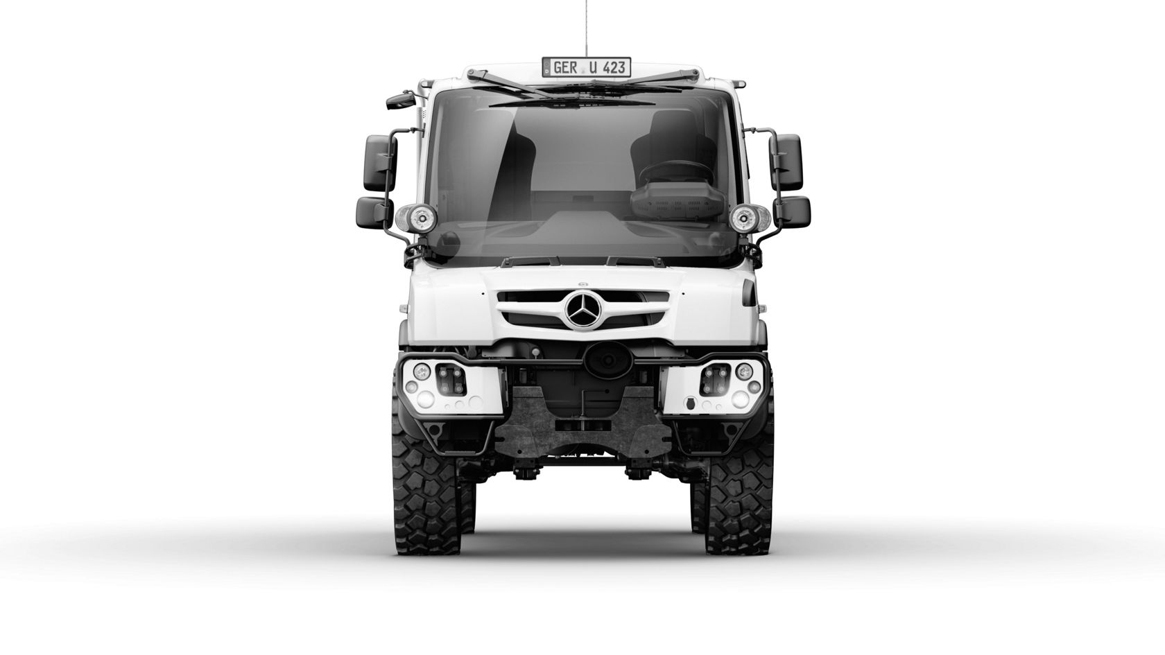 Black and white front view of a Unimog. The truck is on a white background.